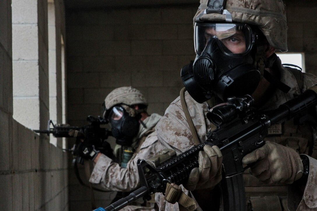 Marines with 1st Battalion, 7th Marine Regiment provide security in a simulated combat town during the culminating event of Division School’s Urban Leaders Course aboard Camp Pendleton, Calif., April 22, 2015. The three-week course is designed to prepare Marines to lead in an urban environment.