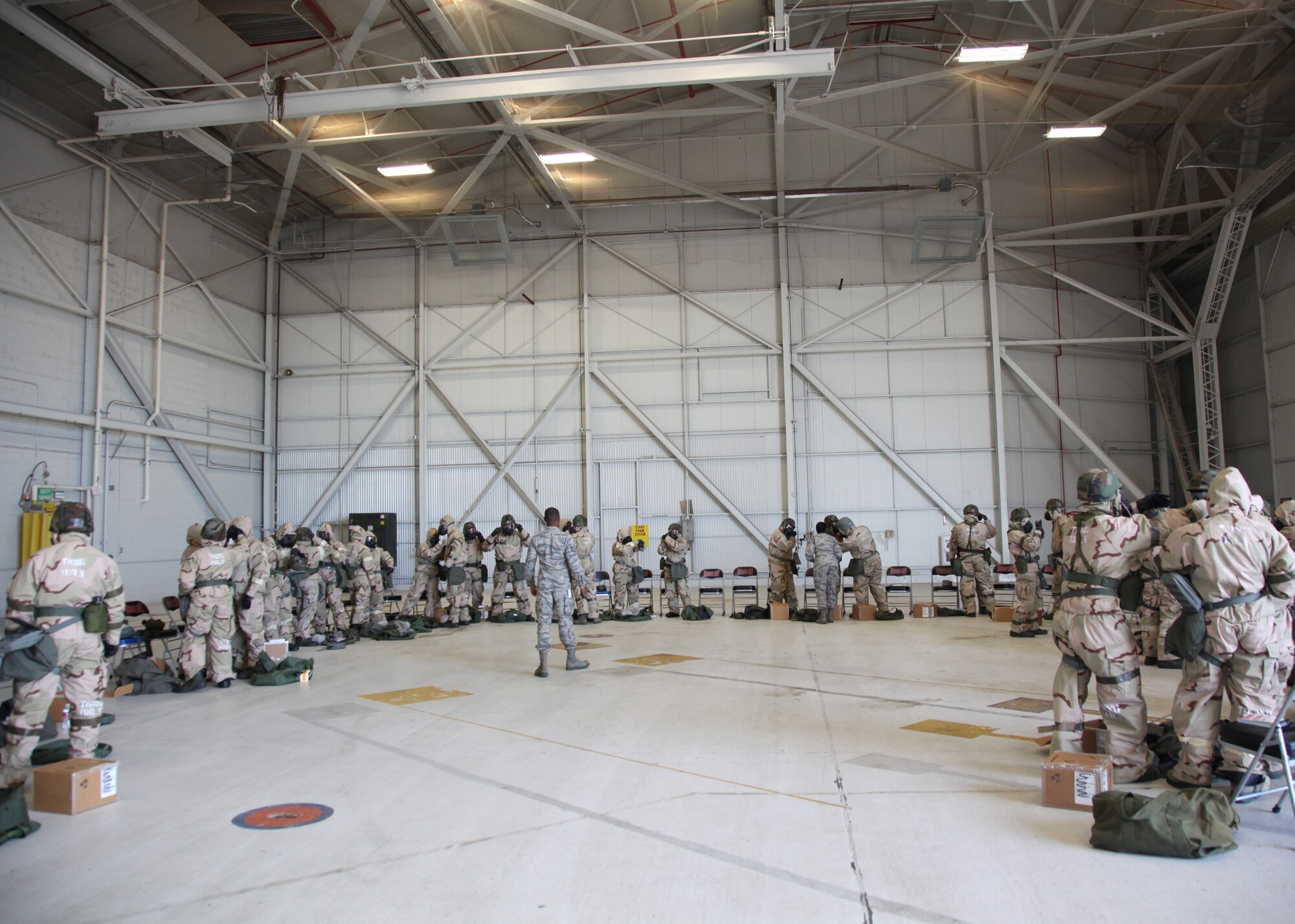 940th Wing Reservists don chemical gear at an operational readiness exercise during the April unit training assembly at Beale Air Force Base, California. During the ORE, reservists responded to simulated biological and chemical attack scenarios. (U.S. Air Force photo by Tech. Sgt. Kenneth McCann/Released)
