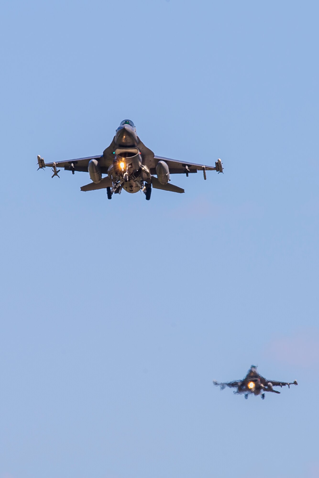 Two U.S. Air Force F-16 Fighting Falcons assigned to the 13th Fighter Squadron, Misawa Air Base, Japan, prepare to land on Eielson Air Force Base, Alaska, May 11, 2015, during RED FLAG-Alaska (RF-A) 15-2. RF-A is a series of Pacific Air Forces commander-directed field training exercises for U.S. and partner nation forces, providing combined offensive counter-air, interdiction, close air support and large force employment training in a simulated combat environment. (U.S. Air Force photo by Staff Sgt. Joshua Turner/Released)