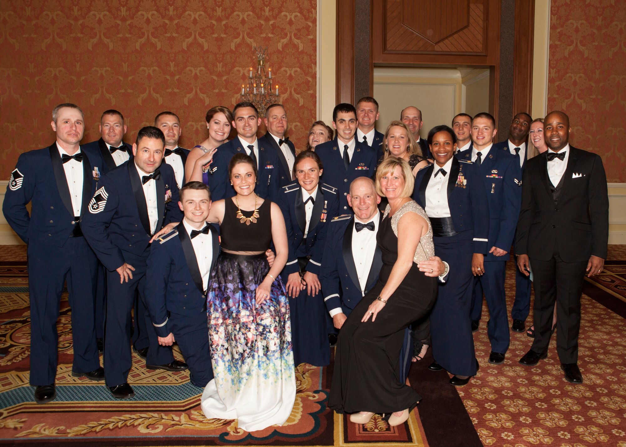 Ninetieth Missile Wing Airmen pose for a group photo during the 90th MW dining-out on May 8, 2015. The dining-out is a formal dinner hosted by the 90th MW to provide military members and their spouses, as well as civilians, the opportunity to meet socially, and create bonds of friendships in an atmosphere which promotes fellowship, camaraderie and esprit de corps. (U.S. Air Force photo by Lan Kim)