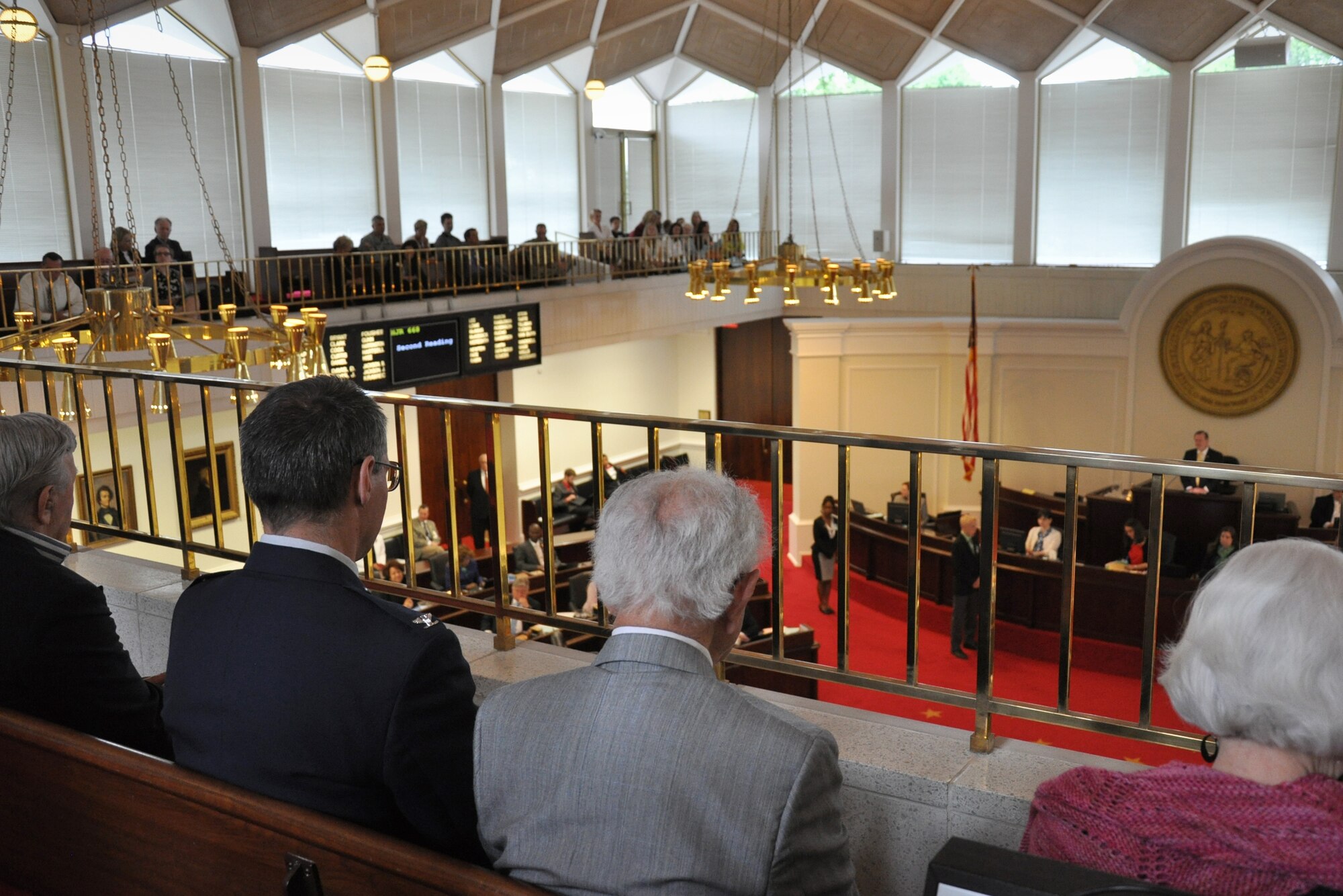 Col. Anthony Polashek, 916th Operations Group commander, witnesses the passage of House Joint Resolution 668, April 29, 2015, by the North Carolina General Assembly which honored Holocaust survivors and U.S. military veterans who aided in their liberation. Also in attendance were Holocaust survivors who were imprisoned at Dachau concentration camp during World War II. (U.S. Air Force photo by Staff Sgt. Alan Abernethy)