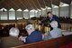 Col. Anthony Polashek, 916th Operations Group commander, speaks with Holocaust survivors who were imprisoned at Dachau concentration camp during World War II. Polashek and the Dachau survivors were in attendance at the North Carolina State Legislative building, April 29, 2015, for the passage of House Joint Resolution 668 by the State General Assembly, which honored Holocaust survivors and U.S. military veterans who aided in their liberation. (U.S. Air Force photo by Staff Sgt. Alan Abernethy)