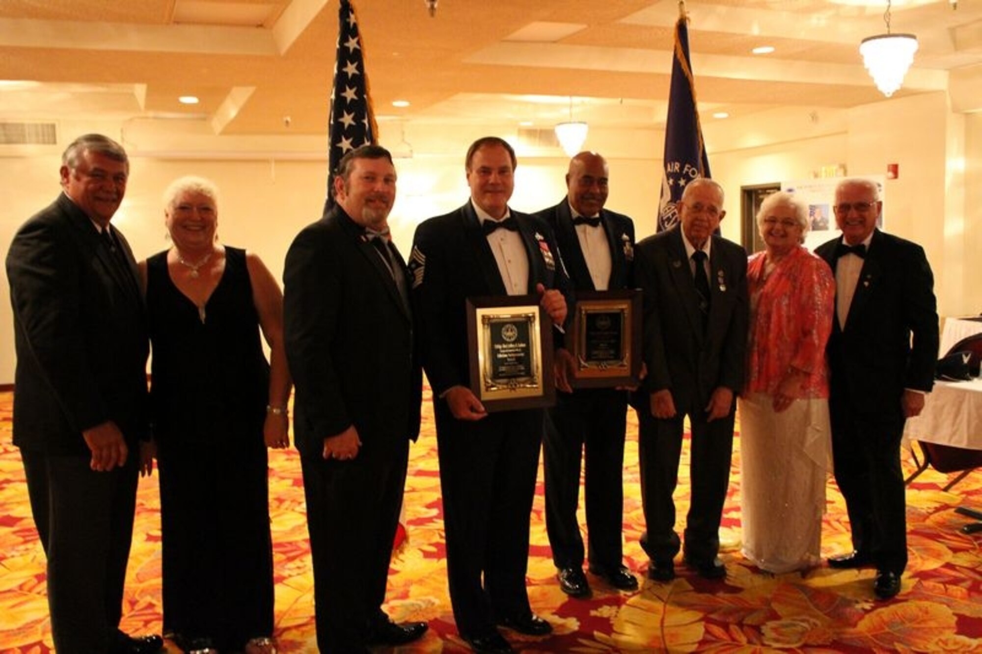 Retired Chief Master Sgt. Jeff Ledoux (Left of center), receives the Division 4  Lifetime Achievement award from Division President Jim Crissinger accompanied by current and former Lifetime Achievement recipients. (Courtesy photo)