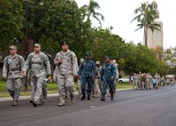 Airmen from the 647th Security Forces Squadron participate in a 2.5 mile ruck march to kick off Police Week on Joint Base Perl Harbor-Hickam, Hawaii, May 5, 2015. In 1962, President John F. Kennedy signed a proclamation that designated May 15th as Peace Officers Memorial Day and the week in which that date falls as Police Week. (U.S. Air Force Photo by Tech Sgt. Aaron Oelrich/Released) 