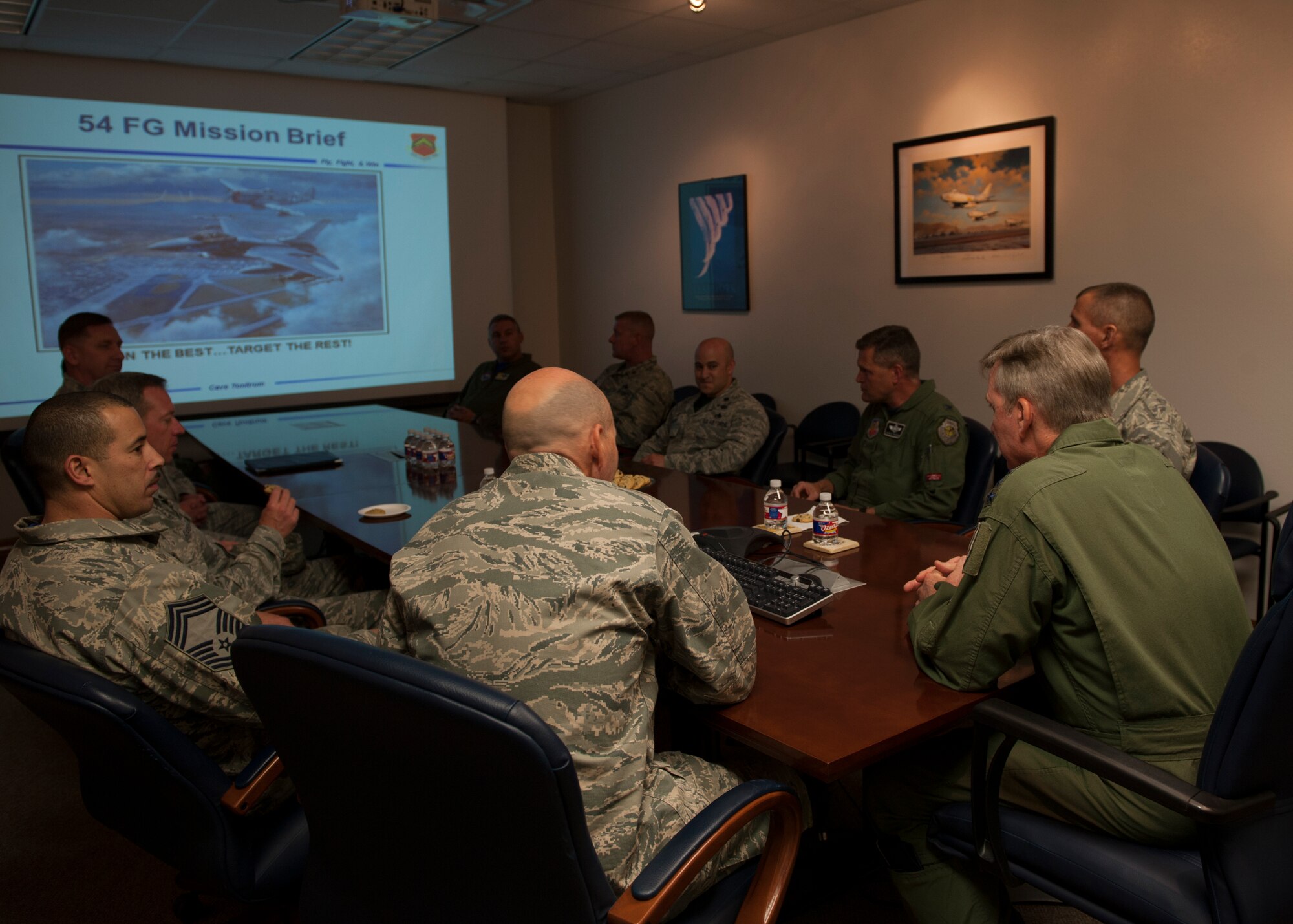 Gen Hawk Carlisle, commander of Air Combat Command, visits the 54th Fighter Group during his immersion visit at Holloman Air Force Base, N.M., May 8, 2015. Carlisle was briefed on the different missions the 54th supports with the help from Holloman’s 49th Wing. The visit included tours and time with the members of Team Holloman, highlighting all the successes Holloman and its tenant units have achieved. This is Carlisle’s first visit to Holloman since taking command of ACC in Oct. 2014. (U.S. Air Force photo by Senior Airman Leah Ferrante/released)