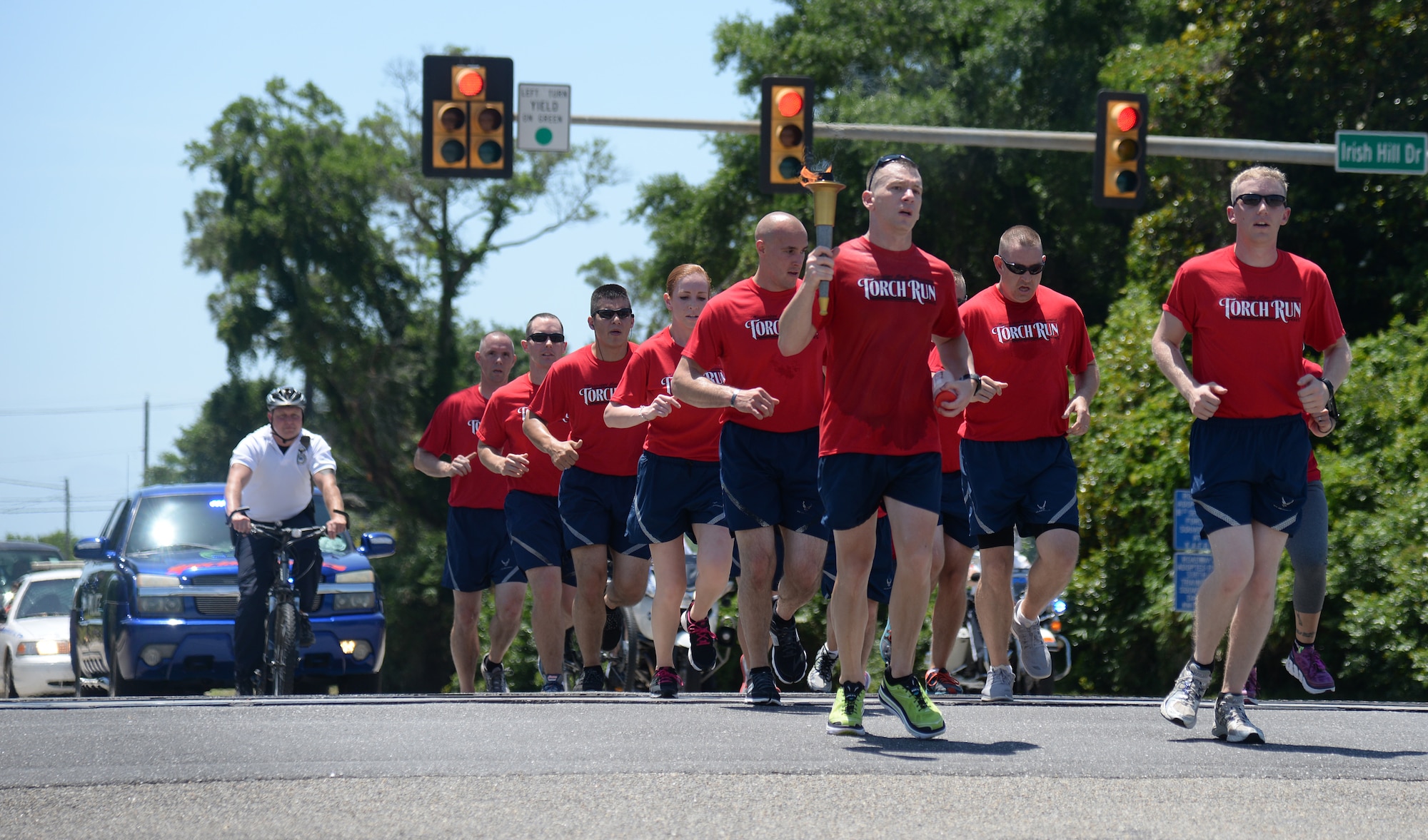 Airmen from the 81st Security Forces Squadron participate in the 2015 Law Enforcement Torch Run for Special Olympics, May 8, 2015, outside of Keesler Air Force Base, Biloxi, Miss. Law enforcement officers from across Mississippi participated in the annual event to escort the Special Olympics Flame of Hope to the opening ceremonies. (U.S. Air Force photo by Senior Airman Holly Mansfield)