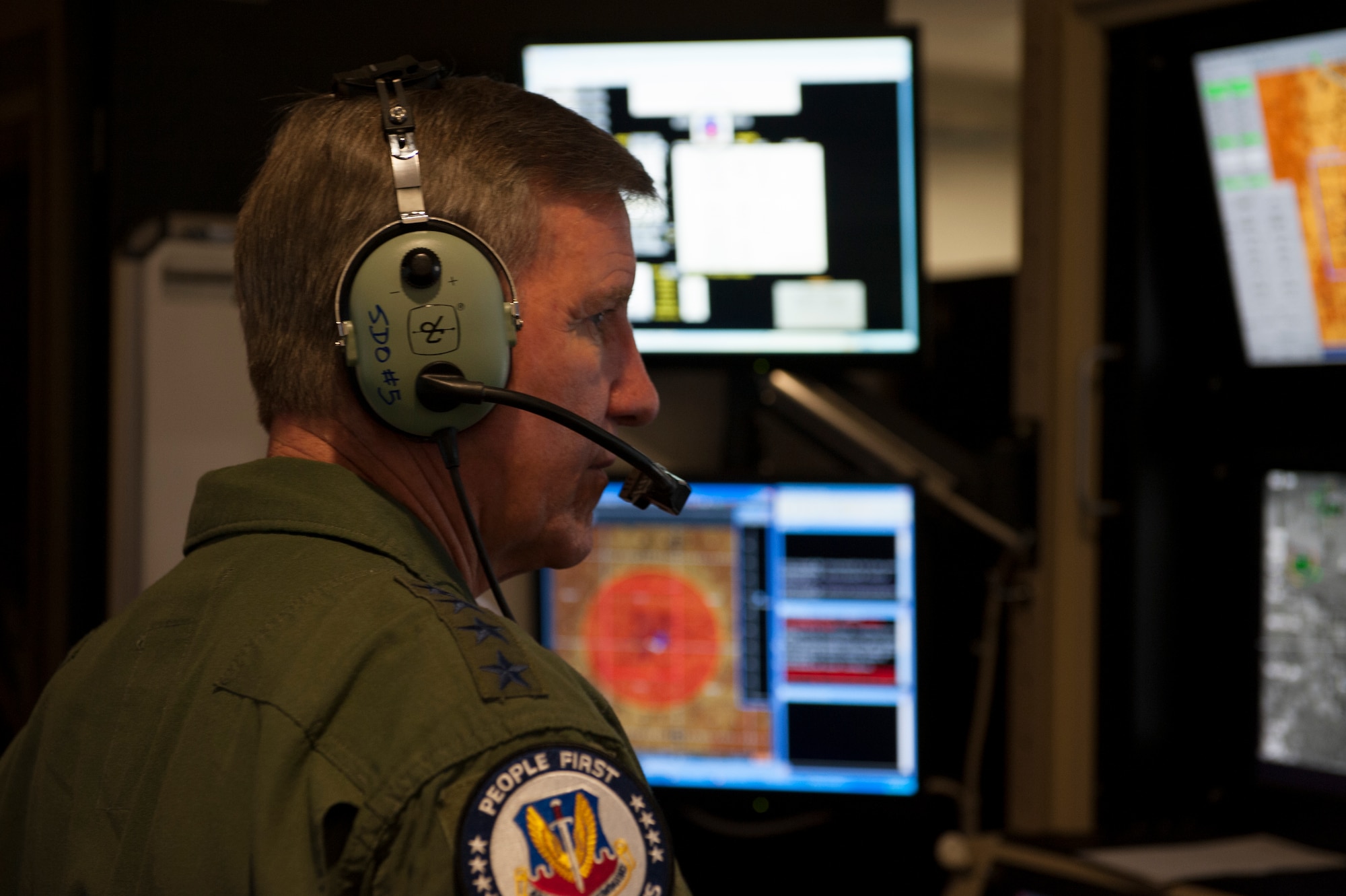 General Hawk Carlisle, commander of Air Combat Command, observes how the 16th Training Squadron’s Ground Control Station Simulators are used during his immersion visit at Holloman Air Force Base N.M., May 8, 2015.  Carlisle served as the Chief of Weapons and Tactics at Holloman from 1984 to 1986, and this is his first visit Holloman since taking command of ACC in Oct. 2014. During the visit the general received a tour of the base and met with various Holloman leaders and Airmen, getting a hands-on look at the various missions Team Holloman supports. (U.S. Air Force photo by Senior Airman Leah Ferrante/released)