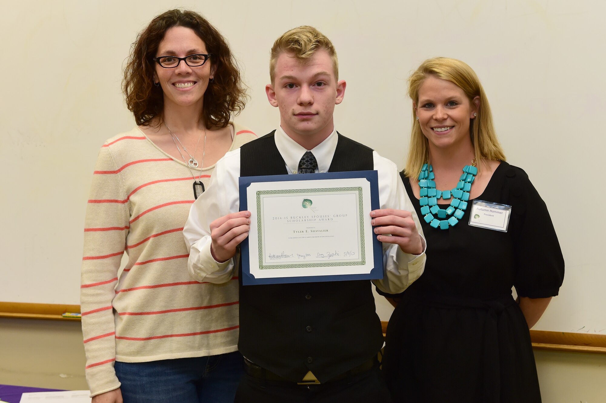 The Buckley Spouses’ Group awarded Tyler E. Shavalier the Military Dependent Scholarship May 9, 2015, on Buckley Air Force Base, Colo. The Spouses’ Group raised and gave away $5,000 in scholarship funds to show support for individuals who are looking to advance through higher education. (U.S. Air Force photo by Airman 1st Class Luke W. Nowakowski/Released)