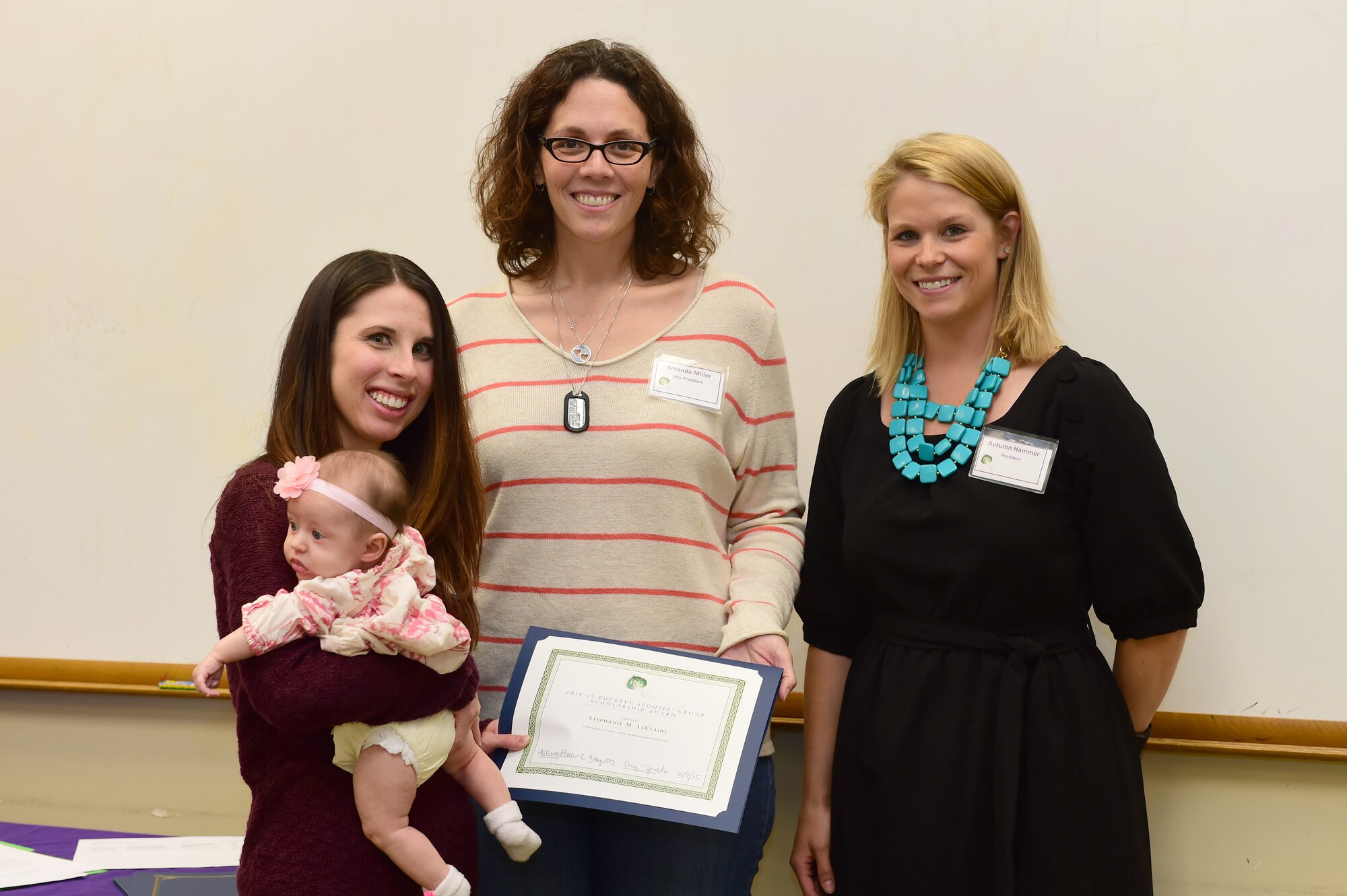 The Buckley Spouses’ Group awarded Stephanie M. LeClaire the Military Spouse Scholarship May 9, 2015, on Buckley Air Force Base, Colo. The Spouses’ Group raised and gave away $5,000 in scholarship funds to show support for individuals who are looking to advance through higher education. (U.S. Air Force photo by Airman 1st Class Luke W. Nowakowski/Released) 