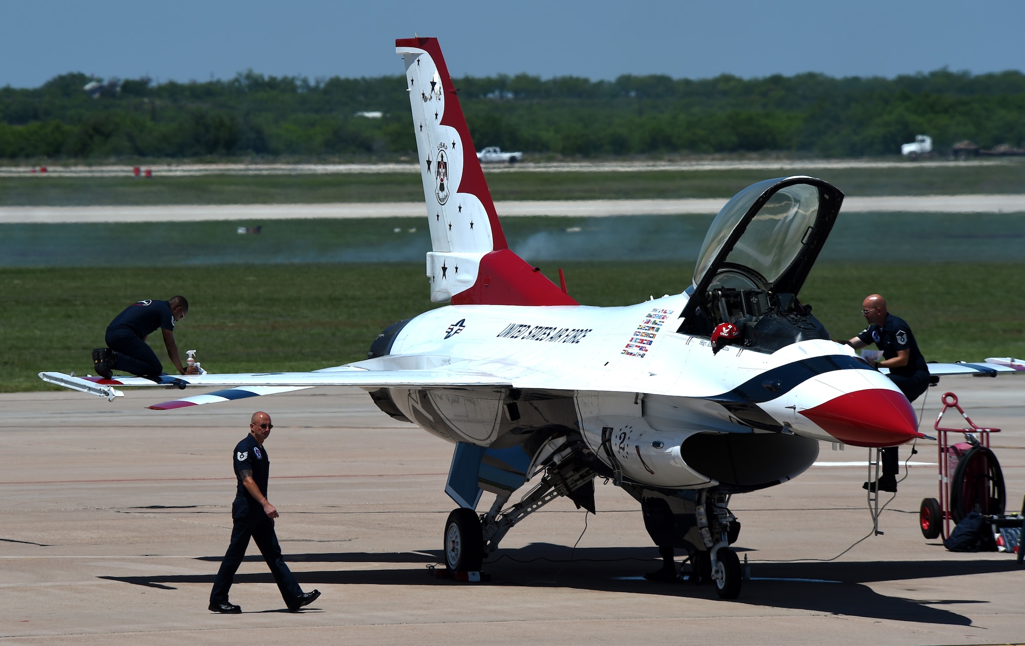 Airmen from the Air Force Thunderbirds demonstration team prepare an F-16 Fighting Falcon for the 2015 Dyess Big Country Airfest May 3, 2015 at Dyess Air Force Base, Texas. The Thunderbirds were the showcase performance for the airshow and accompanied other acts including the Air Force Academy Wings of Blue and the U.S. Army Golden Knights parachute teams. (U.S. Air Force photo by Senior Airman Peter Thompson/Released)
