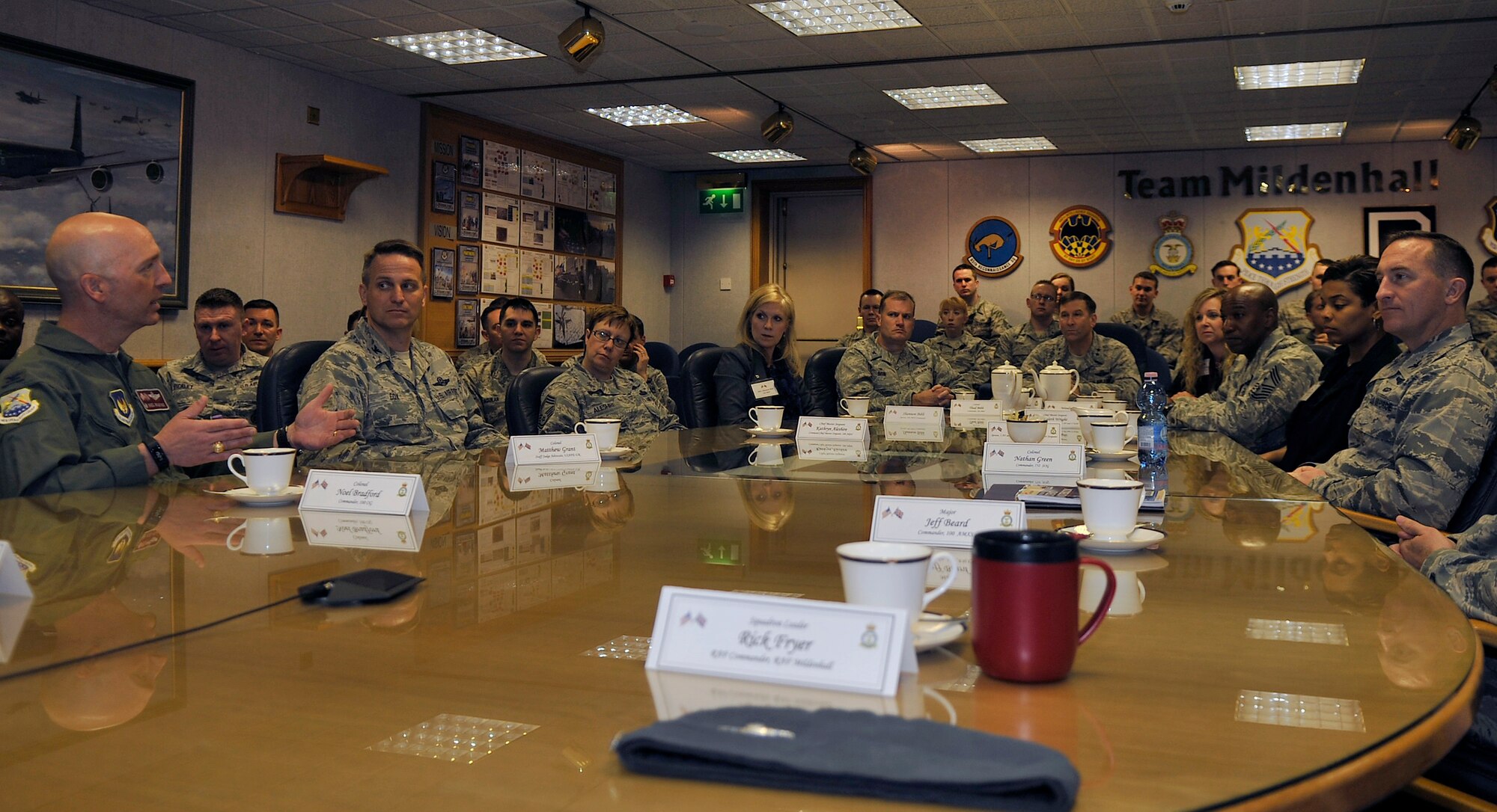 Team Mildenhall leaders brief the 100th Air Refueling Wing mission to 3rd Air Force and 17th Expeditionary Air Force command leadership May 7, 2015, on RAF Mildenhall, England. U.S. Air Force Maj. Gen. Christopher Bence, 3rd Air Force and 17th Expeditionary Air Force vice commander, and U.S. Air Force Chief Master Sgt. Kaleth Wright, 3rd AF and 17th EAF command chief master sergeant visited the 100th as part of a base tour to gain insight on the different missions and daily operations. (U.S. Air Force photo by Airman 1st Class Kyla Gifford/Released)