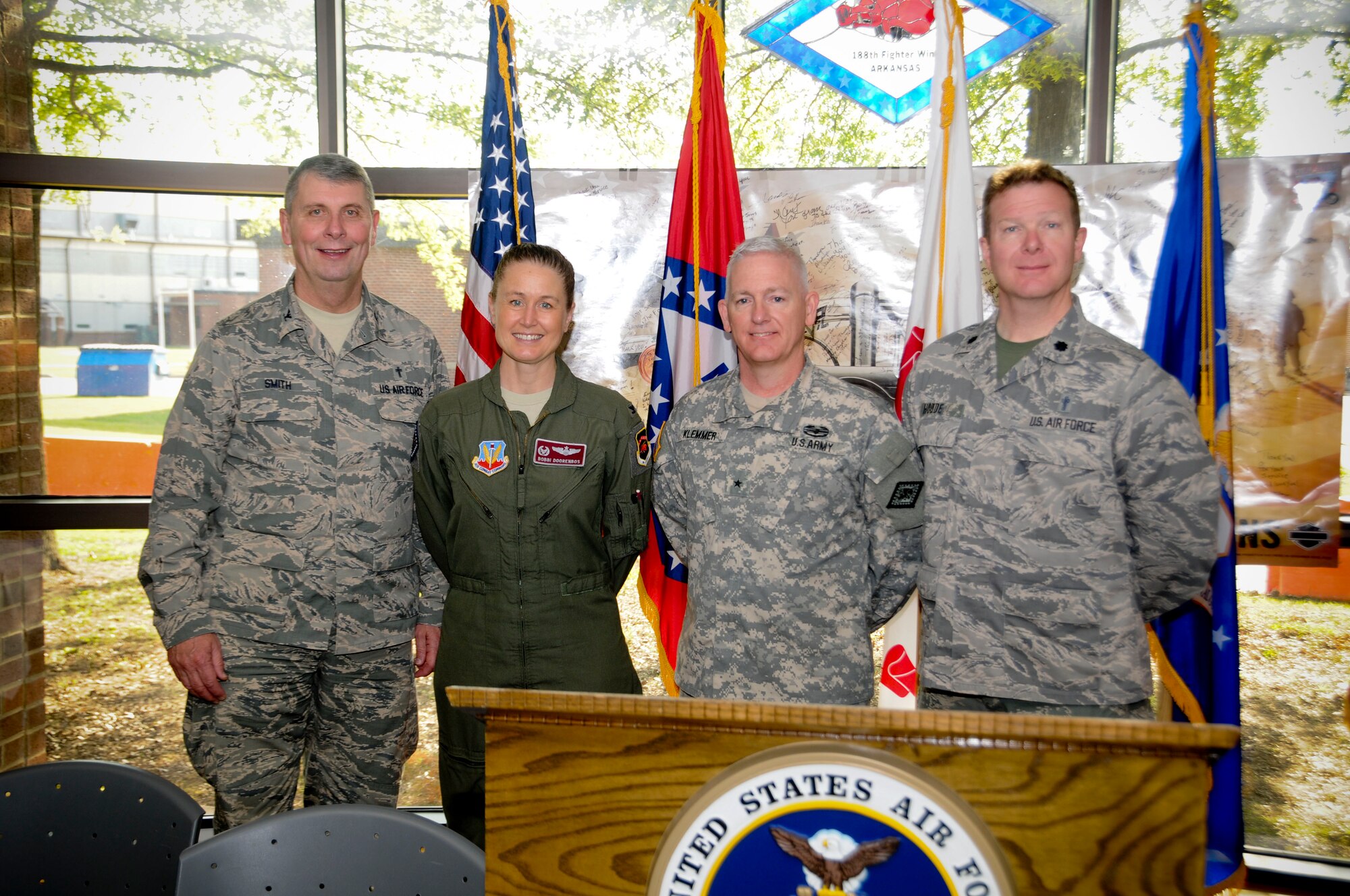From left, Col. Tom Smith, Col. Bobbi Doorenbos, Brig. Gen. Keith Klemmer and Lt. Col. Herb Hodde pose for a photo during a prayer breakfast held May 3, 2015 at Ebbing Air National Guard Base, Fort Smith, Ark. Smith is the Joint Force Headquarters Command chaplain, Doorenbos is the 188th Wing commander, Klemmer is the Arkansas deputy adjutant general and Hodde is a chaplain for the 188th. The breakfast was hosted by the 188th Chaplain's office to support the Airmen in their spiritual beliefs. (U.S. Air National Guard photo by Senior Airman Cody Martin/released)