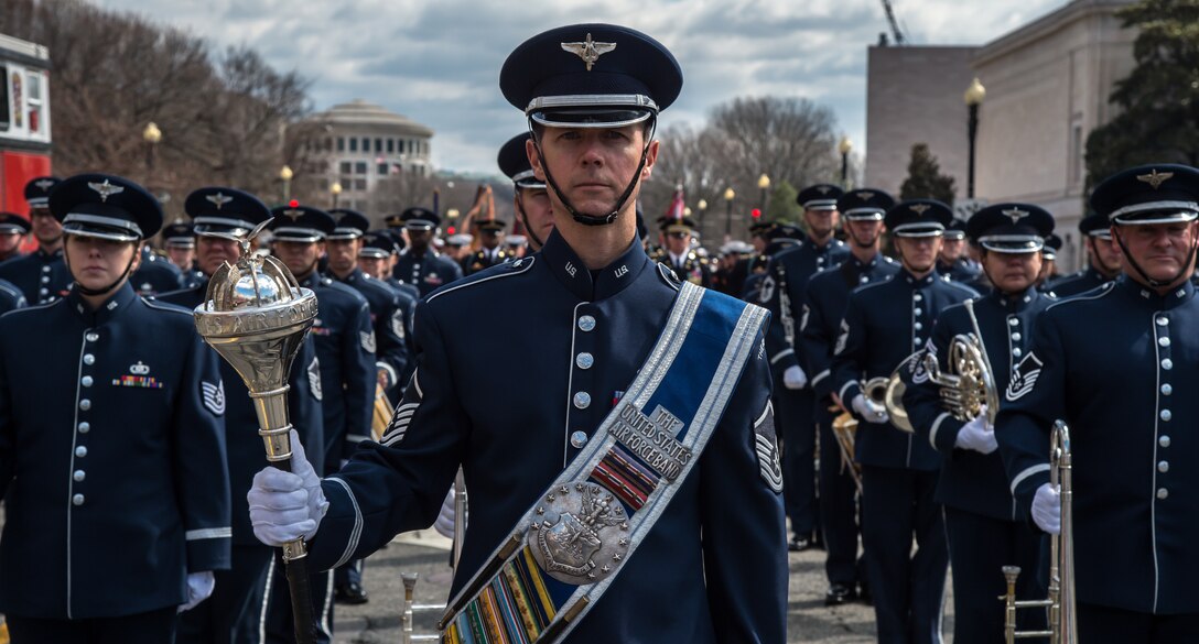 U.S. Air Force Concert Band and Ceremonial Brass members prepare to march down Constitution Ave., in Washington, D.C., March 15, 2015. These members led the way during the 44th Annual St. Patrick’s Parade. (U.S. Air Force photo by Airman 1st Class Philip Bryant/released) 