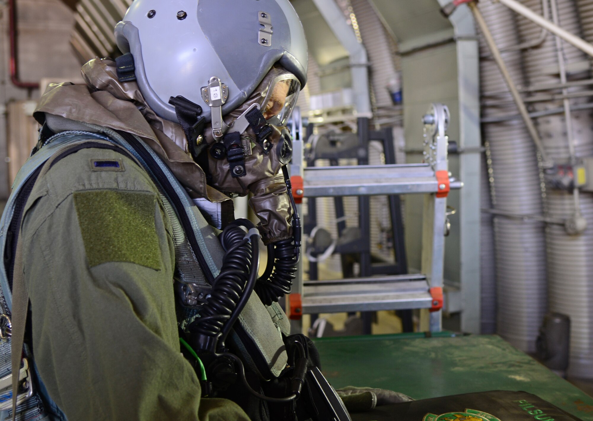 1st Lt. Matthew Barrett, 25th Fighter Squadron pilot, pauses during the making of a training video May 4, 2015, at Osan Air Base, Republic of Korea. Barrett assisted with the video in preparation for exercise Beverly Midnight 15-02 which is designed to test American forces in the ROK on their mission readiness in the event of an emergency or wartime environment. (U.S. Air Force photo by Staff Sgt. Benjamin Sutton/Released)