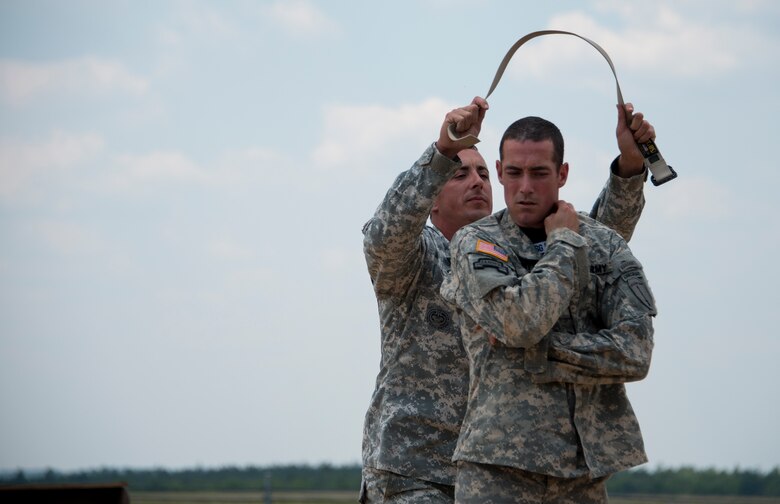 Soldiers from the 6th Ranger Training Battalion perform hand-to-hand combat maneuvers during a demonstration at the Rangers’ Open House event May 9 at Eglin Air Force Base, Fla. The event was a chance for the public to learn how Rangers train and operate. The event displays showed equipment, weapons, a reptile zoo, face painting and weapon firing among others. The demonstrations showed off hand-to-hand combat, a parachute jump, snake show, and Rangers in action. (U.S. Air Force photo/Tech. Sgt. Jasmin Taylor)