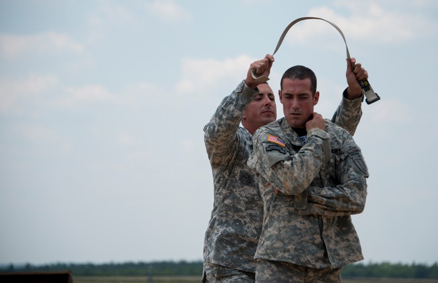 Soldiers from the 6th Ranger Training Battalion perform hand-to-hand combat maneuvers during a demonstration at the Rangers’ Open House event May 9 at Eglin Air Force Base, Fla. The event was a chance for the public to learn how Rangers train and operate. The event displays showed equipment, weapons, a reptile zoo, face painting and weapon firing among others. The demonstrations showed off hand-to-hand combat, a parachute jump, snake show, and Rangers in action. (U.S. Air Force photo/Tech. Sgt. Jasmin Taylor)