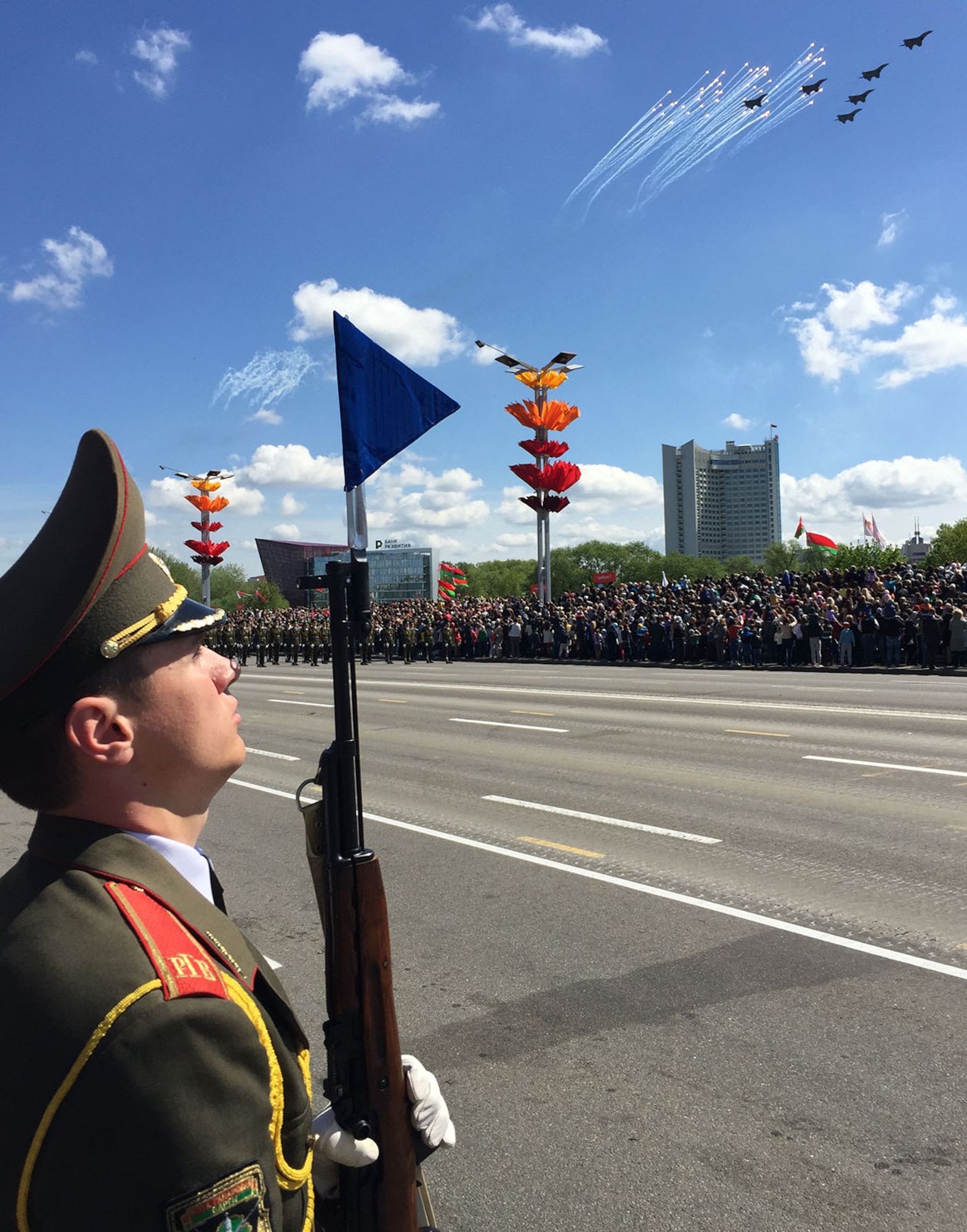MINSK, BELARUS -- An Armed Forces of Belarus soldier stands at attention as 
Belarussian air force aircraft provide an air power demonstration during the 
World War II Victory Day Parade May 9, 2015, in Minsk, Belarus. For the first 
time in Belarus' history, participants from the U.S. Department of Defense 
marched in the parade to commemorate the sacrifices of the World War II Allies 
and the end of hostilities 70 years ago. Thirty-four Airmen from the U.S. Air 
Forces in Europe Band joined more than 5,000 Belarussian soldiers and 250 
military vehicles in the Victory Day Parade. (U.S. Air Force photo by Master 
Sgt. Brian Bahret)
