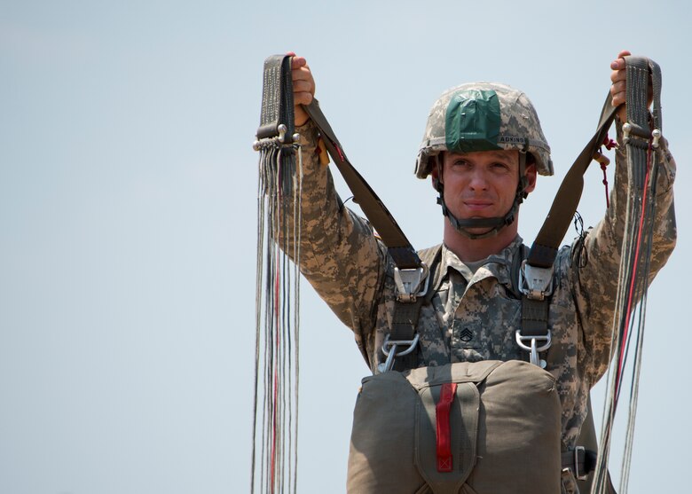 A Ranger from the 6th Ranger Training Battalion demonstrates parachute jump procedures during a demonstration at the Rangers’ Open House event May 9 at Eglin Air Force Base, Fla. The event was a chance for the public to learn how Rangers train and operate. The event displays showed equipment, weapons, a reptile zoo, face painting and weapon firing among others. The demonstrations showed off hand-to-hand combat, a parachute jump, snake show, and Rangers in action. (U.S. Air Force photo/Tech. Sgt. Jasmin Taylor)