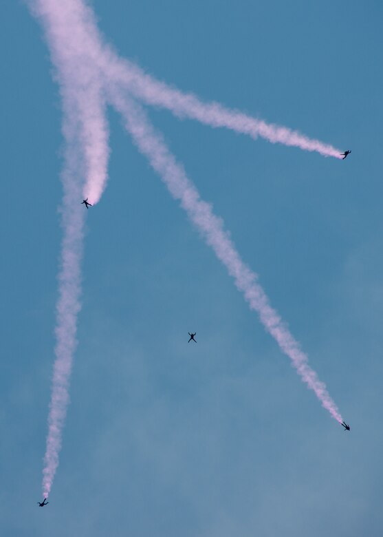 Soldiers perform a parachute jump procedures during a demonstration at the Rangers’ Open House event May 9 at Eglin Air Force Base, Fla. The event was a chance for the public to learn how Rangers train and operate. The event displays showed equipment, weapons, a reptile zoo, face painting and weapon firing among others. The demonstrations showed off hand-to-hand combat, a parachute jump, snake show, and Rangers in action. (U.S. Air Force photo/Tech. Sgt. Jasmin Taylor)