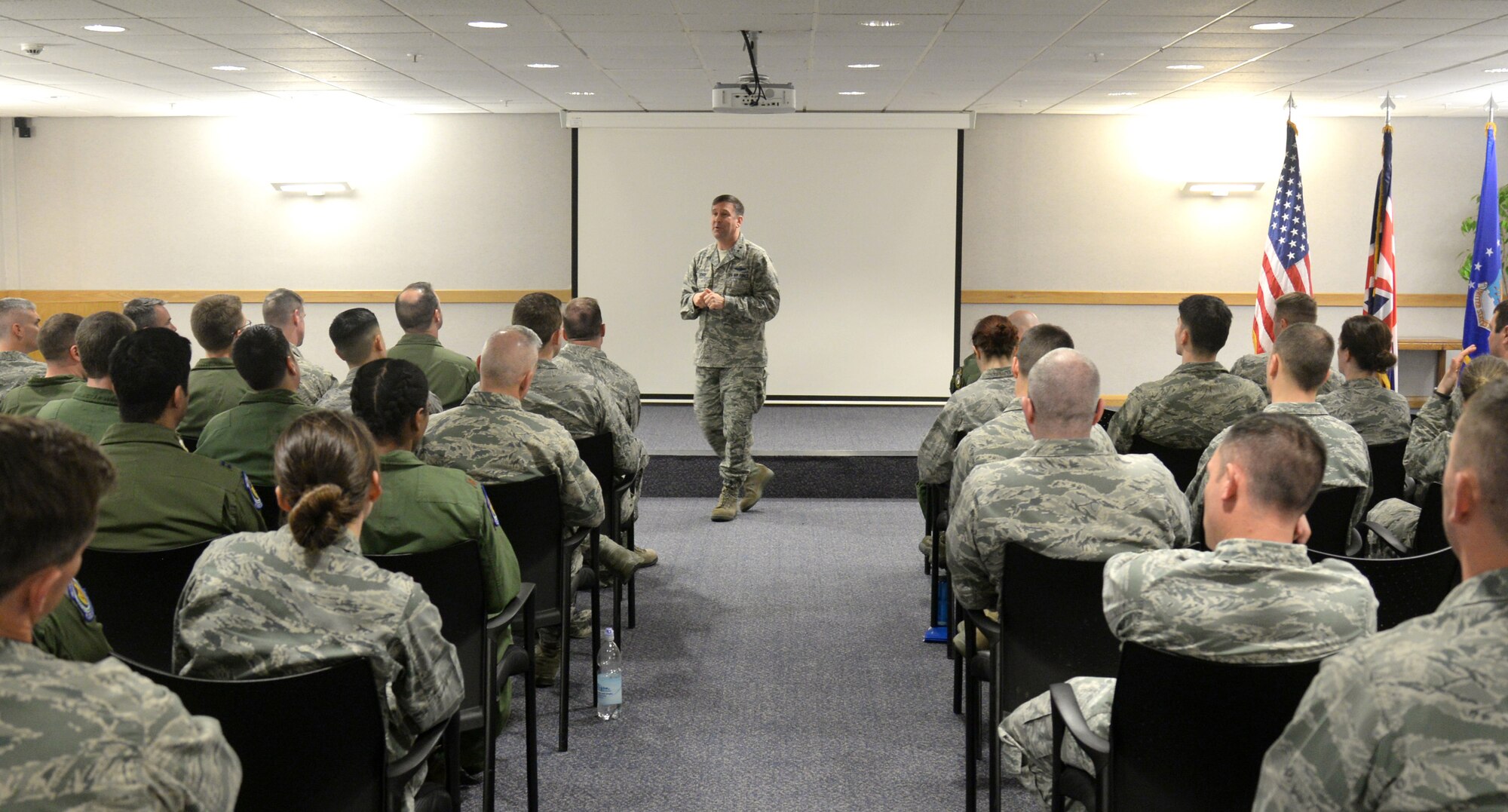 U.S. Air Force Maj. Gen. Christopher Bence, 3rd Air Force and 17th Expeditionary Air Force vice commander, speaks to Team Mildenhall members May 7, 2015, during an officers all-call on RAF Mildenhall, England. All-calls, typically hosted by commanders from the wing-level or above, are a way to distribute information to a large audience and allow the host to answer questions on-the-spot. (U.S. Air Force photo by Senior Airman Kate Thornton/Released)