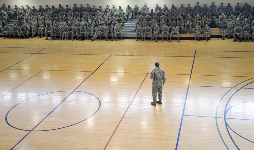 U.S. Air Force Chief Master Sgt. Kaleth Wright, 3rd Air Force and 17th Expeditionary Air Force command chief master sergeant, speaks to Team Mildenhall members May 7, 2015, at an enlisted all-call on RAF Mildenhall, England. All-calls, typically hosted by commanders from the wing-level or above, are a way to distribute information to a large audience and allow the host to answer questions on-the-spot. (U.S. Air Force photo by Senior Airman Kate Thornton/Released)