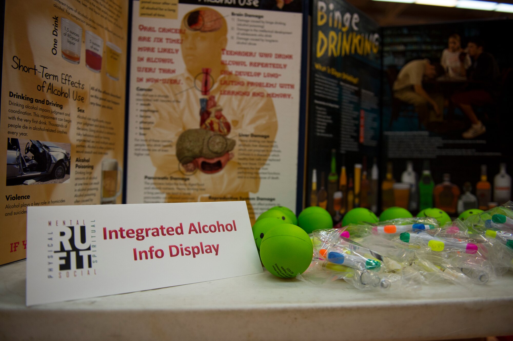 A table displays alcohol information at the Skelton Memorial Fitness Center during the “RUFit for Summer” event on Spangdahlem Air Base, Germany, May 8, 2015. The event’s goal was to raise awareness on the benefits of physical activity, healthy nutrition, summer safety and the danger of alcohol abuse. (U.S. Air Force photo by Airman 1st Class Luke Kitterman/Released)  