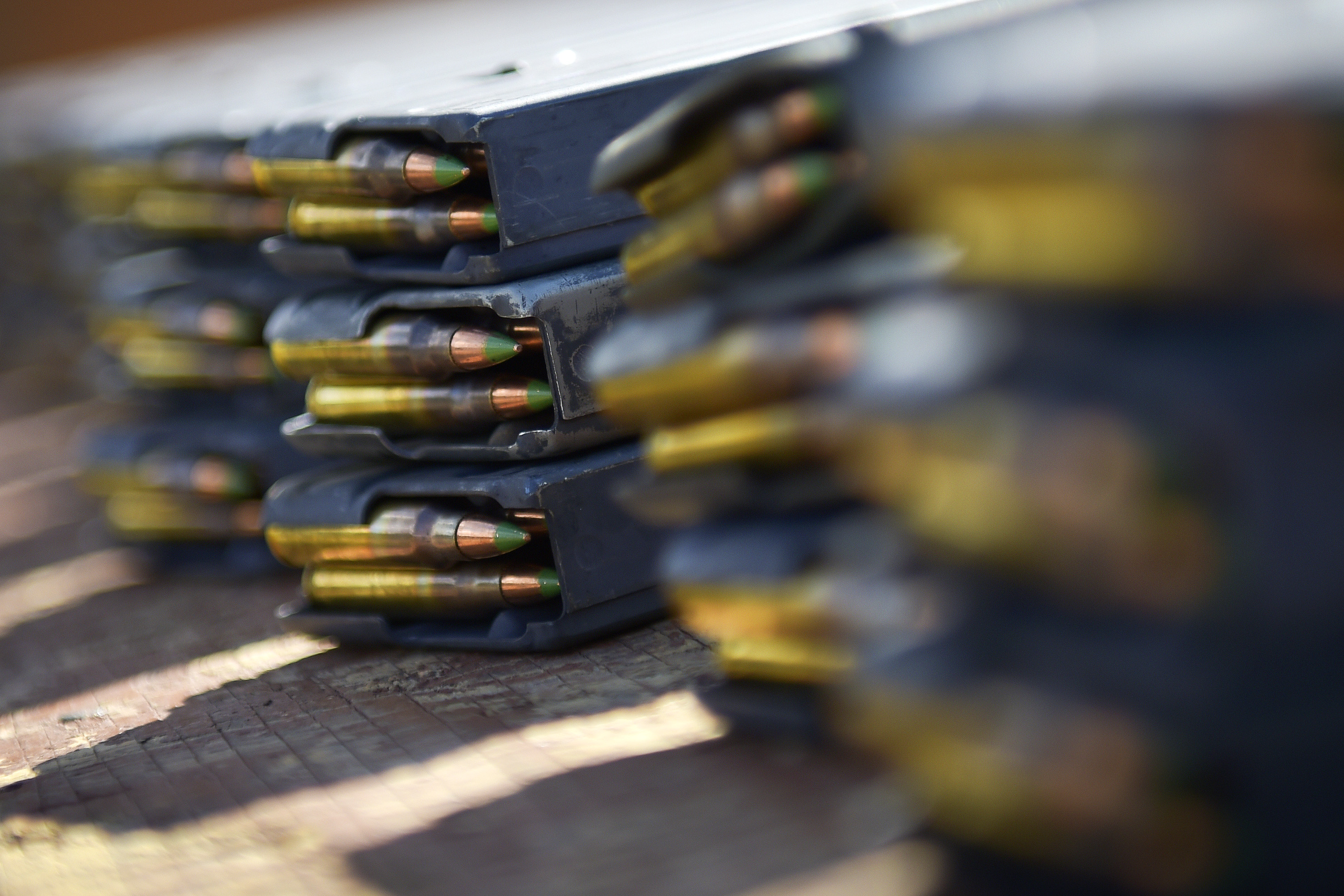 Ammunition magazines are lined up, ready for soldiers participating in