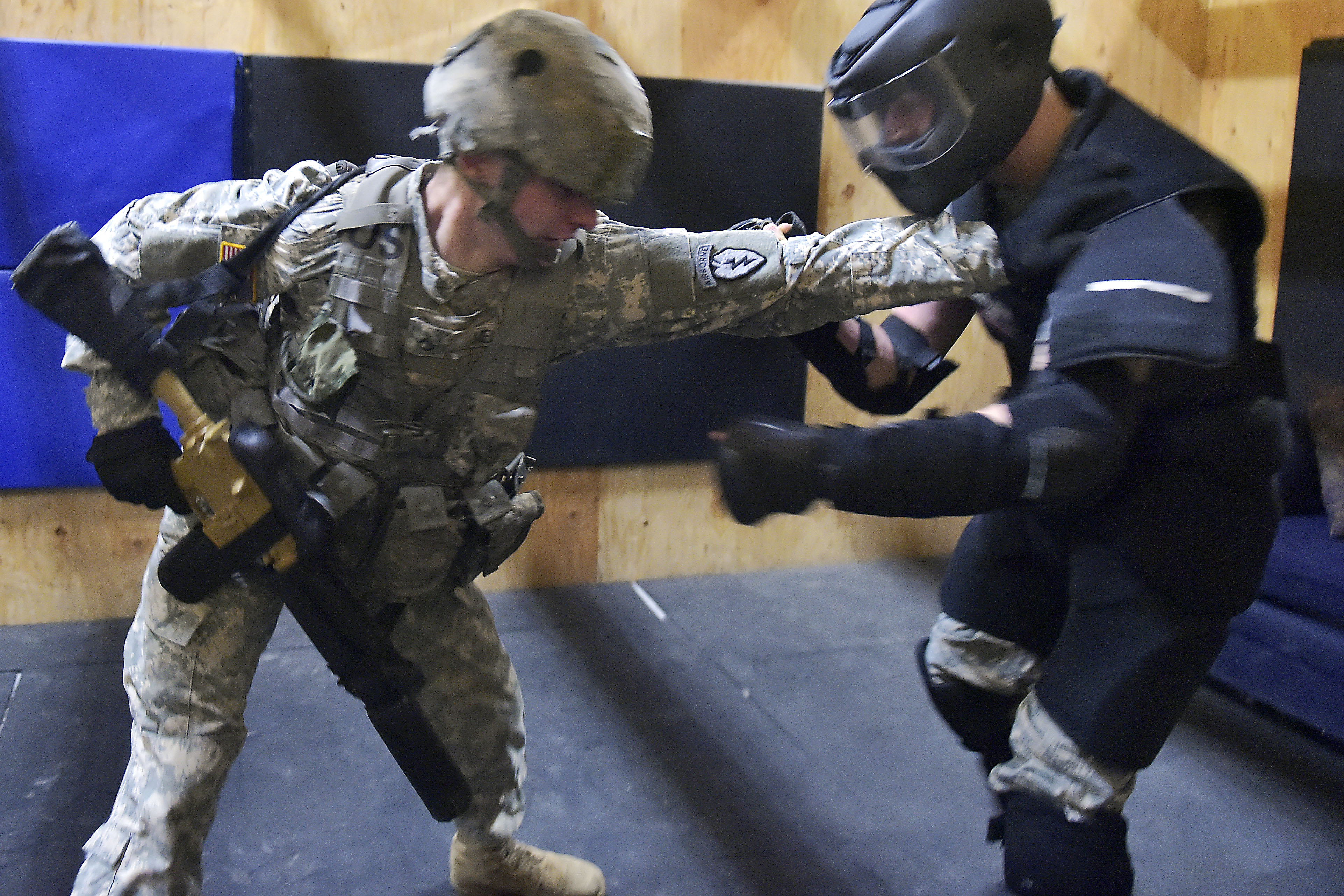 Army Pfc. Colton Melzo fights off an attacker during a combined ...