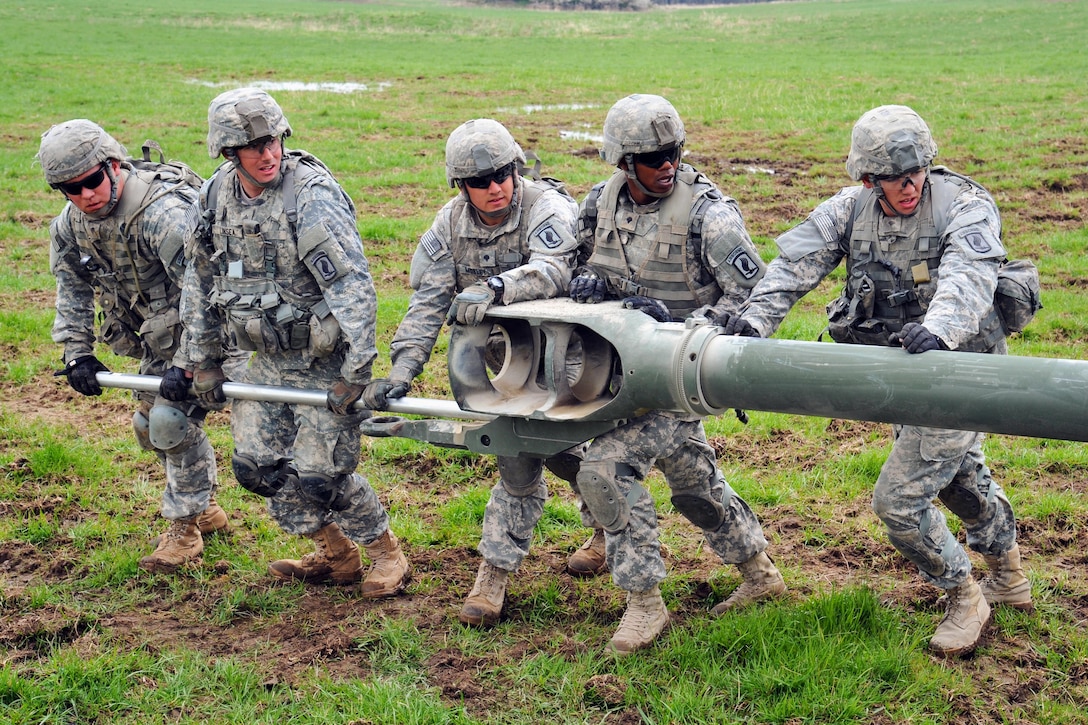 U.S. paratroopers set up a M777A2 howitzer for a live-fire exercise at the Joint Multinational Training Command's Grafenwoehr Training Area in Germany, April 30, 2015. The paratroopers are assigned to the 4th Battalion, 319th Airborne Field Artillery Regiment, 173rd Airborne Brigade. The exercise marked the first firing of the new howitzer in the brigade, increasing the ability to deliver lethal fires in support of exercises and operations.