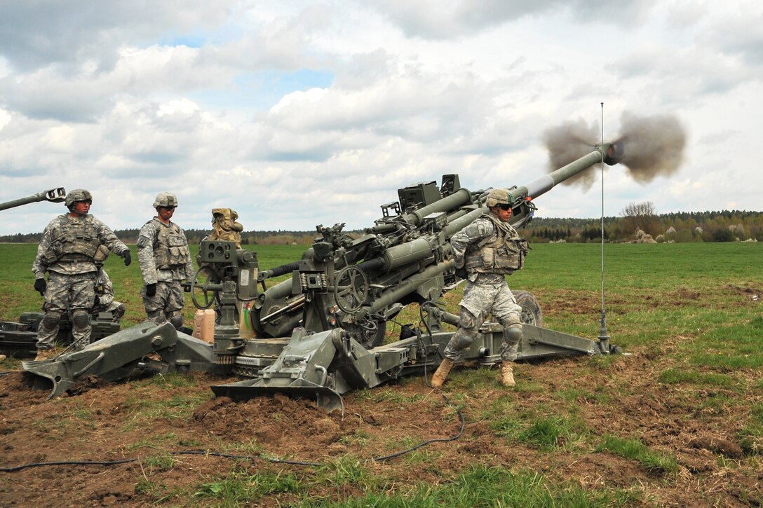 A U.S. paratrooper fires a M777A2 howitzer during a live-fire exercise at the Joint Multinational Training Command's Grafenwoehr Training Area in Germany, April 30, 2015.