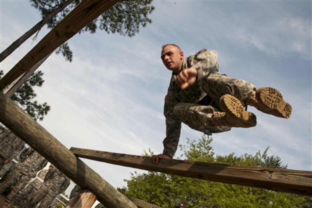 Army Sgt. Dan Kernan demonstrates how to scale an obstacle for competitors in the 2015 U.S. Army Reserve Best Warrior Competition on Fort Bragg, N.C., May 6, 2015. The top noncommissioned officer and junior enlisted soldier in the competition will represent the Army Reserve in the U.S. Best Warrior Competition later this year on Fort Lee, Va. Kernan is a drill sergeant.