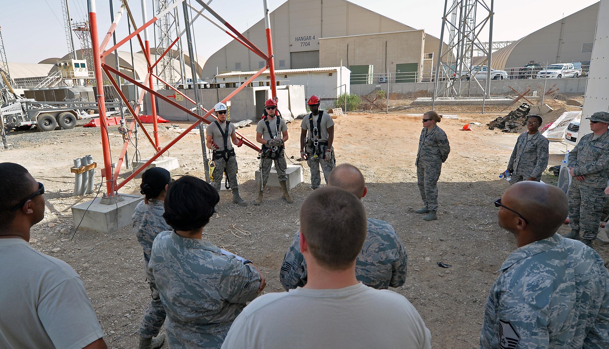 Staff Sgt. William, RF Transmissions craftsman, explains proper pre-climb procedures to base personnel in support of the Air Force fall protection focus initiative at an undisclosed location in Southwest Asia May 11, 2015. According to the Air Force Safety Center website, The Fall Protection Focus alerts the entire Air Force family - active duty, civilian, Guard, Reserve and family members - of what can be done to prevent fall-related injuries and deaths. (U.S. Air Force photo/Tech. Sgt. Jeff Andrejcik)