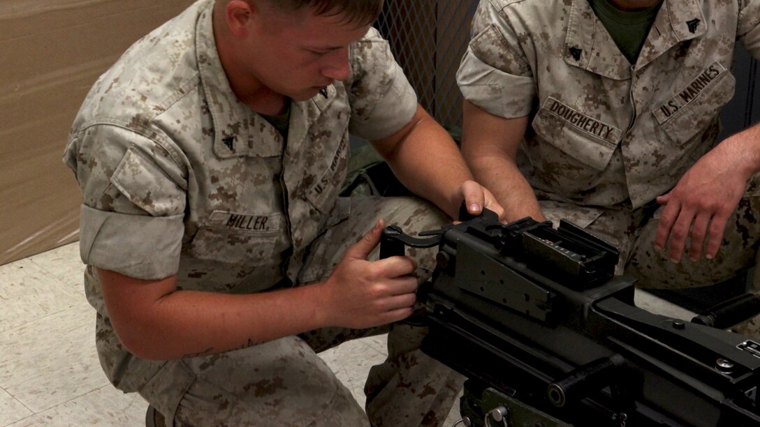Lance Cpl. Zachary Miller, a motor vehicle operator with 2nd Light Armored Reconnaissance Battalion, 2nd Marine Division function checks a Mk-19 automatic grenade launcher during a Machine Gunners Course at the Division Combat Skills Center aboard Marine Corps Base Camp Lejeune, North Carolina, April 15, 2015. During the course the Marines were trained how to properly disassemble, reassemble and maintain the M249 squad automatic weapon, the M240B machine gun, Browning M2 .50 caliber machine gun and the MK19 automatic grenade launcher. (U.S. Marine Corps photo by Pfc. David N. Hersey/Released)