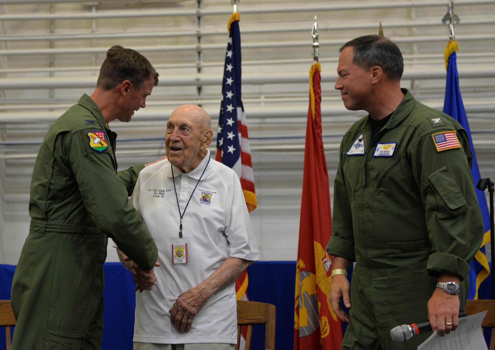 Retired Lt. Col. Dick Cole, a Doolittle Raider, greets Col. Thomas Shank, 479th Flying Training Wing commander, and Capt. Edward Heflin, 6th Training Air Wing commodore, at the Doolittle Raiders ceremony at Naval Air Station Pensacola May 8, 2015. Cole was Lt. Col. Jimmy Doolittle’s co-pilot during the Doolittle Raid over Tokyo April 18, 1942. (U.S. Air Force photo/1st Lt. Ben Sowers)