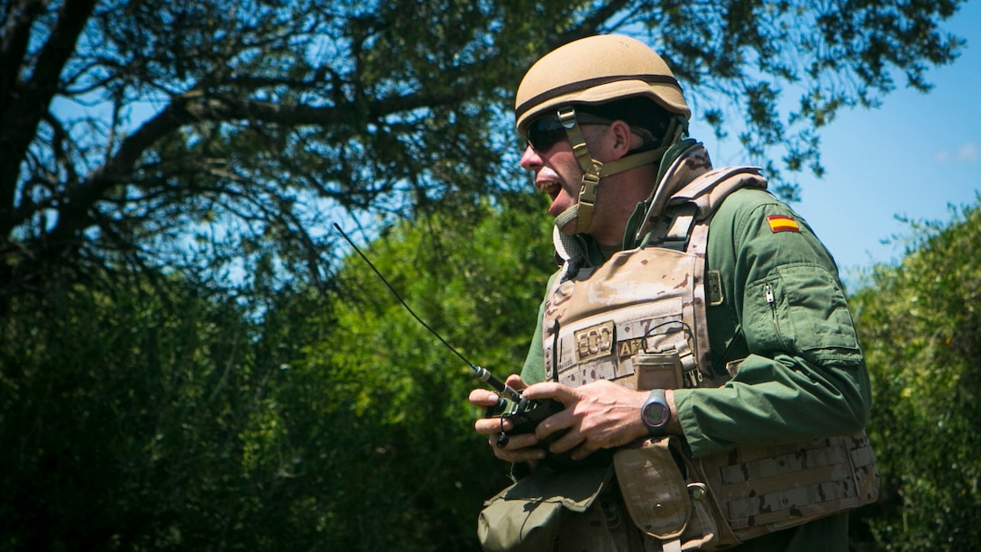 A Spanish Marine explosive ordnance disposal technician detonates a charge on a range with U.S. Marine EOD technicians in Sierra Del Retin, Spain, May 5, 2015. The two groups worked side by side during a three-day training exercise designed to hone their ability conduct bilateral operations in the future. (U.S. Marine Corps photo by Sgt. Paul Peterson/Released)