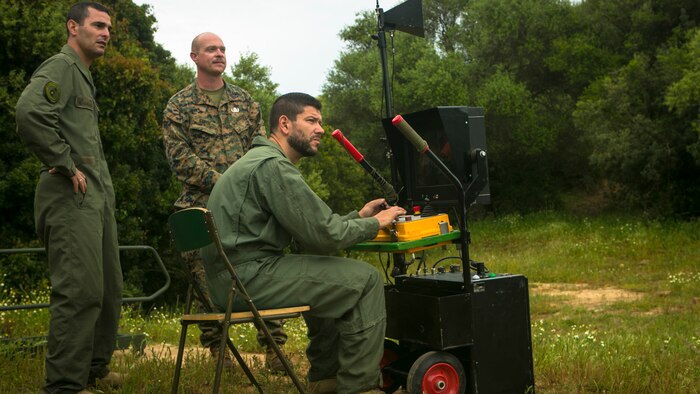 Spanish and U.S. Marine explosive ordnance disposal technicians monitor an bomb disposal robot during a training exercise in Sierra Del Retin, Spain, May 5, 2015. EOD technicians from Special-Purpose Marine Air-Ground Task Force Crisis Response-Africa joined their Spanish counterparts and completed a three-day training operation, which included live-demolition operations. (U.S. Marine Corps photo by Sgt. Paul Peterson/Released)