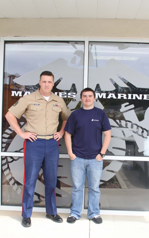 Dylan DeYoung, a poolee with Permanent Contact Station Smithfield, poses for a picture with U.S. Marine Corps Staff Sgt. Michael L. Block, a recruiter, outside of PCS Smithfield, North Carolina, April 29, 2015. DeYoung lost more than 70 pounds over the course of 17 months to join the Marine Corps. (U.S. Marine Corps photo by Sgt. Dwight A. Henderson/Released)