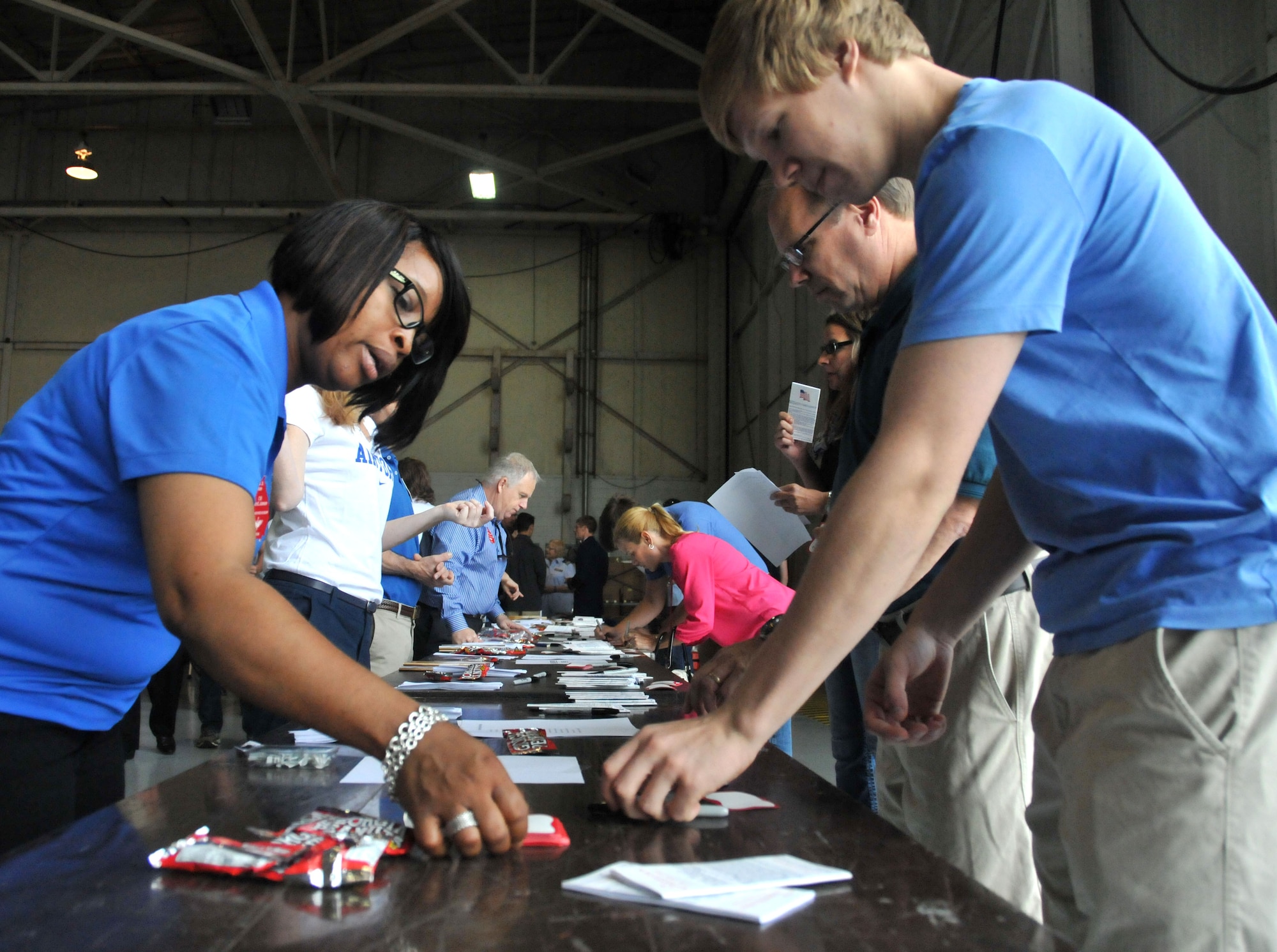 Attendees register for Academy Day in Hangar 5 at Dobbins Air Reserve Base, Ga. on May 9, 2015.  The annual event provides high school students the opportunity to meet with representatives from each of the service academies, including West Point, the U.S. Naval Academy, the U.S. Air Force Academy, the Coast Guard Academy, and the U.S. Merchant Marines Academy. (USAF photo by Senior Airman Andrew J. Park)