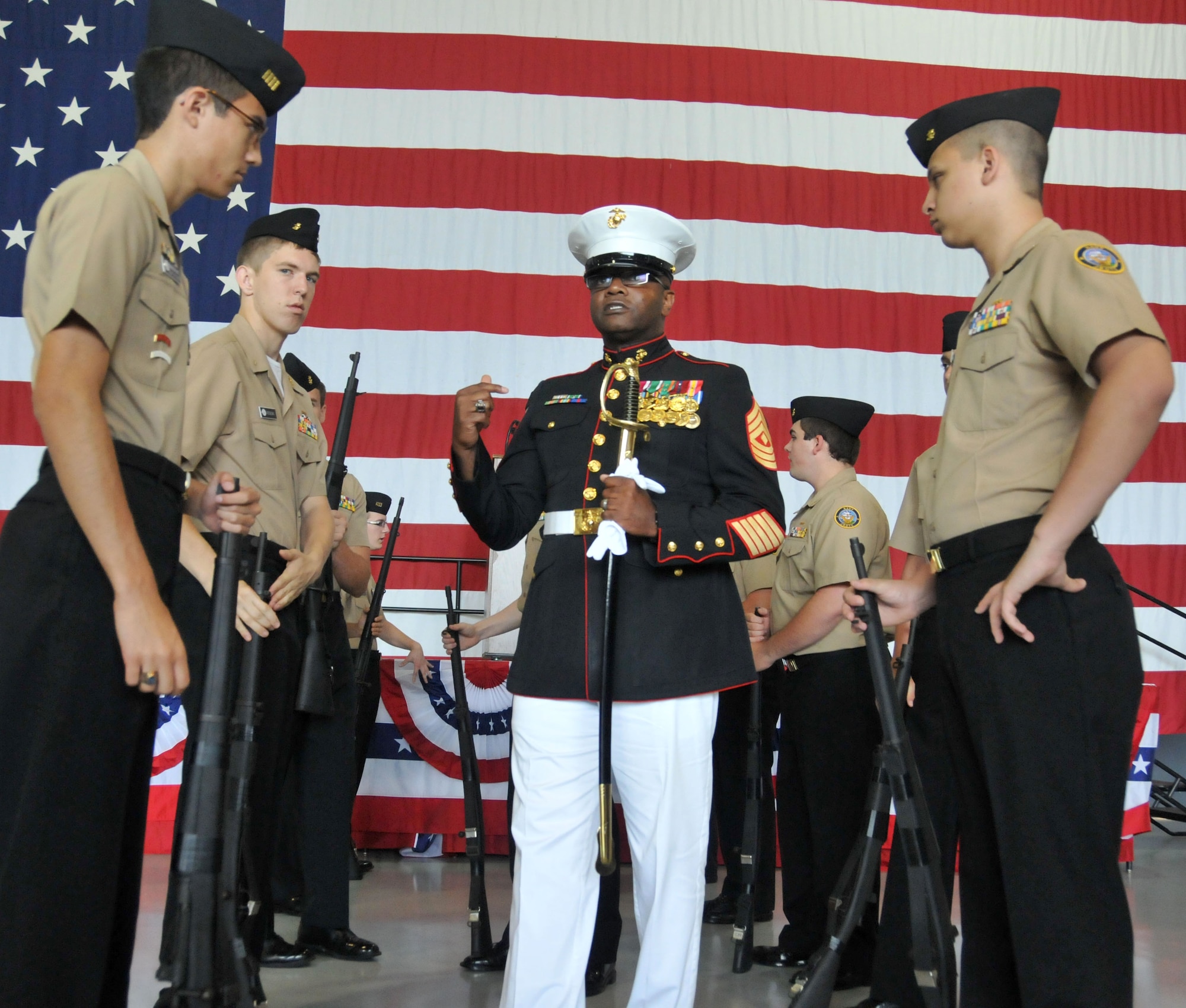 The Lassiter High School Drill Team practices their routine in Hangar 5 for Academy Day at Dobbins Air Reserve Base, Ga. on May 9, 2015. The annual event provides high school students the opportunity to meet with representatives from each of the service academies, including West Point, the U.S. Naval Academy, the U.S. Air Force Academy, the Coast Guard Academy, and the U.S. Merchant Marines Academy.  (USAF photo by Senior Airman Andrew J. Park)