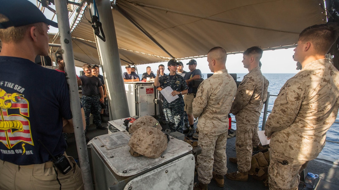 Lt. Cmdr. Janice Pollard, center, the commanding officer of mine countermeasures ship USS Sentry, briefs Sailors with the ship’s crew and Marines with Weapons Company, Battalion Landing Team 3rd Battalion, 6th Marine Regiment, 24th Marine Expeditionary Unit, on standard operating procedures for a joint-small caliber action team prior to transiting the Strait of Bab al Mandeb, April 28, 2015. Marines from the 24th MEU augmented SCAT capabilities during the ship’s strait transit. The 24th MEU is embarked on the ships of the Iwo Jima Amphibious Ready Group and is deployed to maintain regional security in the U.S. 5th Fleet Area of operations. 