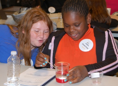 Mariah Greenwood and Paris Alexander from JB Nachman Elementary conduct a sand-investigation experiment of nanotechnology during a class at the Lousiana National Guard youth program Pelican State STARBASE at Camp Beauregard in Pineville, La. Fifth grade students from across the parish come to STARBASE to learn about science, technology, engineering and math concepts during a five day course curriculum that involve both hands on and classroom teachings.