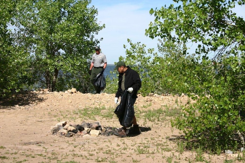 JOHN MARTIN RESERVOIR, Colo. – Local volunteers and park rangers pick up trash along the south shoreline of the reservoir, May 2, 2015.