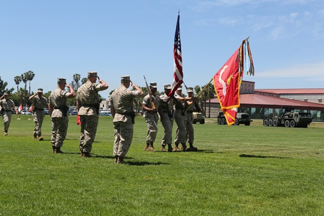 Commanding Officer and Sergeant’s Major render honors to the National Ensign and Marine Corps Colors.