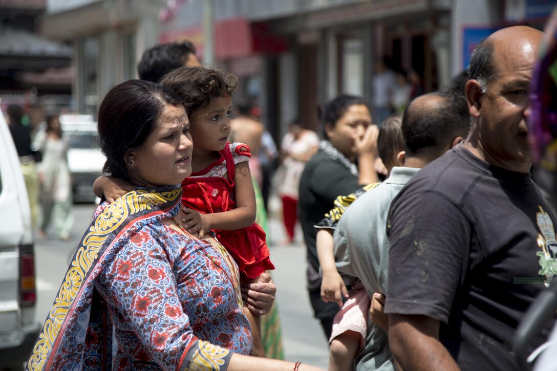 Nepalese citizens race into the streets of Kathmandu, Nepal, in response to a 7.3 magnitude aftershock hitting the country. Joint Task Force 505 along with other multinational forces and humanitarian relief organizations are currently in Nepal providing aid after a 7.8 magnitude earthquake struck the country, April 25. At Nepal’s request the U.S. government ordered JTF 505 to provide unique capabilities to assist Nepal.