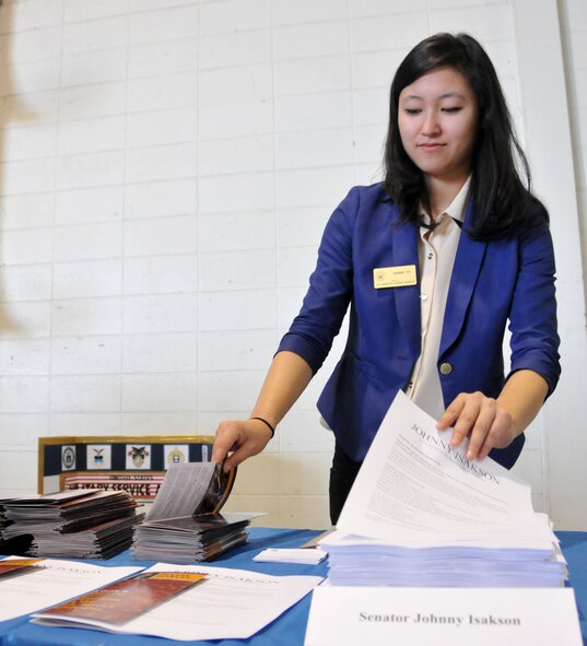 Hanna Yu, constituent services representative, assembles information packets explaining the service academy application process for applying through Senator Johnny Isakson’s office for Academy Day in Hangar 5 at Dobbins Air Reserve Base, Ga. on May 9, 2015.  The annual event provides high school students the opportunity to meet with representatives from each of the service academies, including West Point, the U.S. Naval Academy, the U.S. Air Force Academy, the Coast Guard Academy, and the U.S. Merchant Marines Academy. (USAF photo by Senior Airman Andrew J. Park)