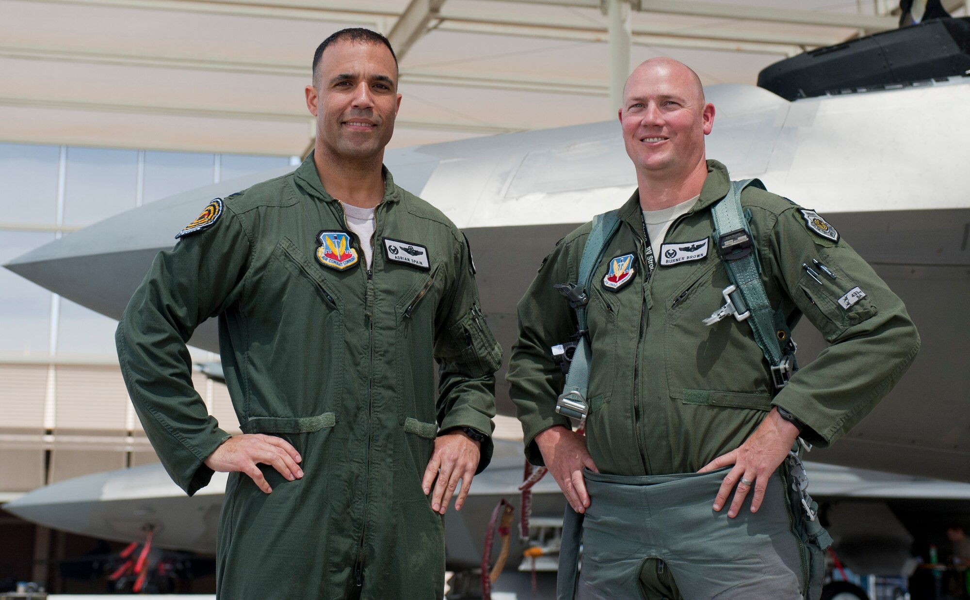 Col. Adrian Spain, U.S. Air Force Weapons School commandant, and Lt. Col. Robert Brown, 433rd Weapons Squadron commander, pose for a picture after Spain’s final flight as the USAFWS commandant at Nellis Air Force Base, Nev., May 11, 2015. Spain is projected to take the 53rd Wing commander position at Eglin AFB, Fla. (U.S. Air Force photo by Airman 1st Class Mikaley Towle)