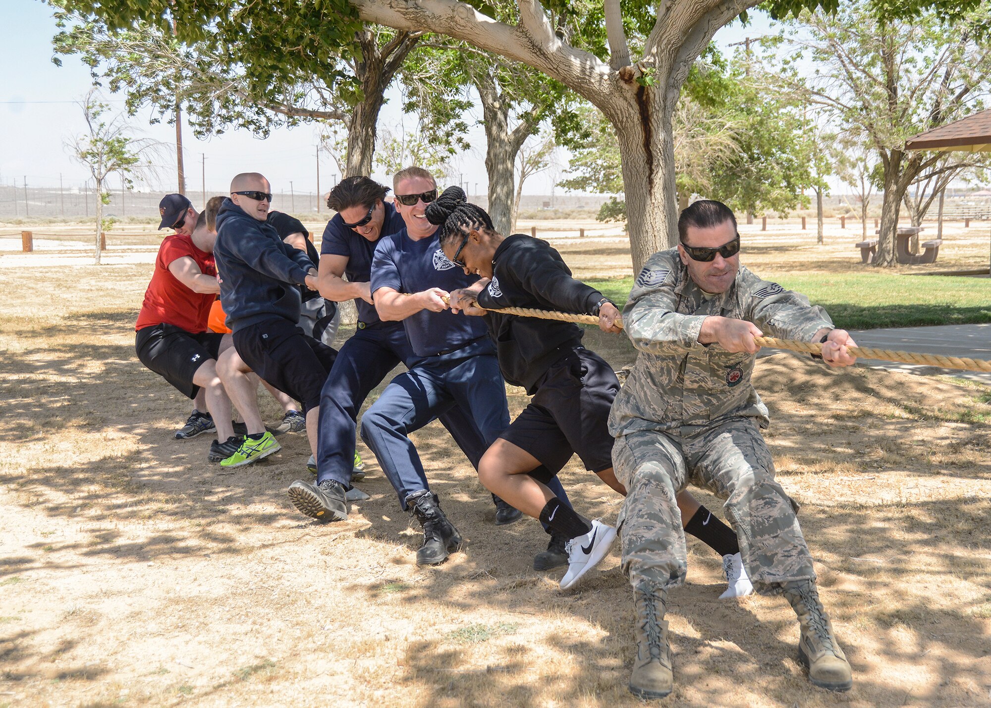 The Edwards AFB Fire Department tugged and tugged but were unable to defeat the 412th Security Forces Squadron in tug-o-war at the First Responders Cookout held May 7 at Arnold Park. (U.S. Air Force photo by Rebecca Amber.)