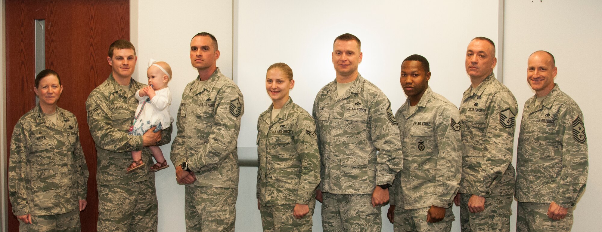 Ninetieth Missile Wing first sergeants' Diamond Sharp Award winners pose with Col. Tracey Hayes, 90th MW commander; Chief Master Sgt. Samuel Couch, 90th MW command chief, and the winners' respective first sergeants during the Diamond Sharp Award presentation May 12, 2015, on F.E. Warren Air Force Base, Wyo. Each month, three first sergeants select an Airman each from their respective squadrons to receive the award. (U.S. Air Force photo by Senior Airman Jason Wiese)