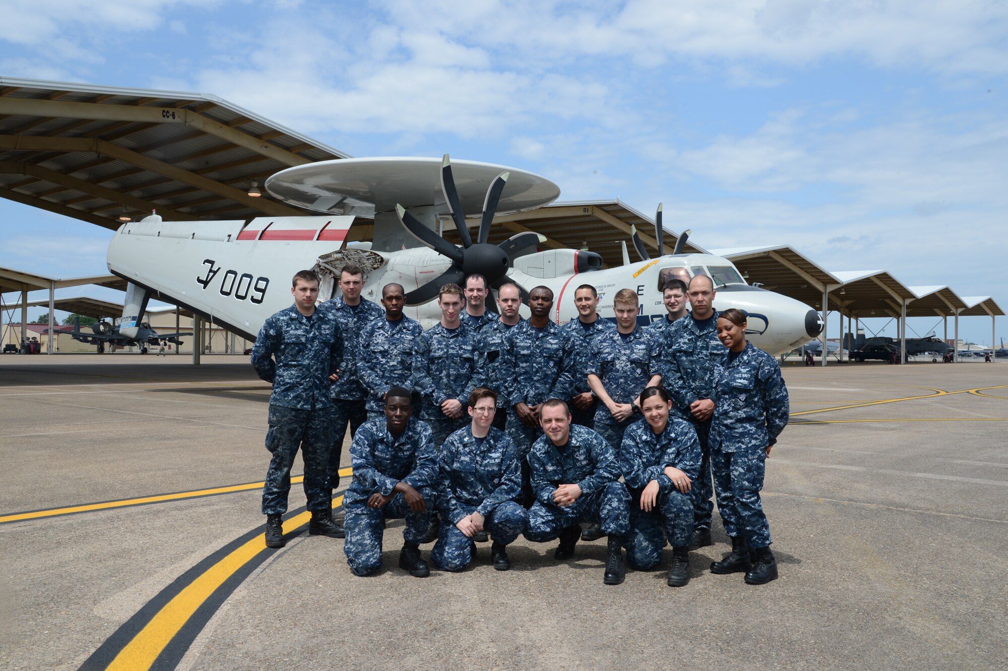 Sailors assigned to the Seahawks of Carrier Airborne Early Warning Squadron VAW-126, Norfolk, Virginia, pose for a group photo in front of an E-2C Hawkeye on Barksdale Air Force Base, Louisiana, April 22, 2015. The VAW-126 participated in a joint exercise, Green Flag East, with the 23rd Fighter Group, Moody Air Force Base, Georgia. (U.S. Air Force photo/Senior Airman Joseph A. Pagán Jr.)