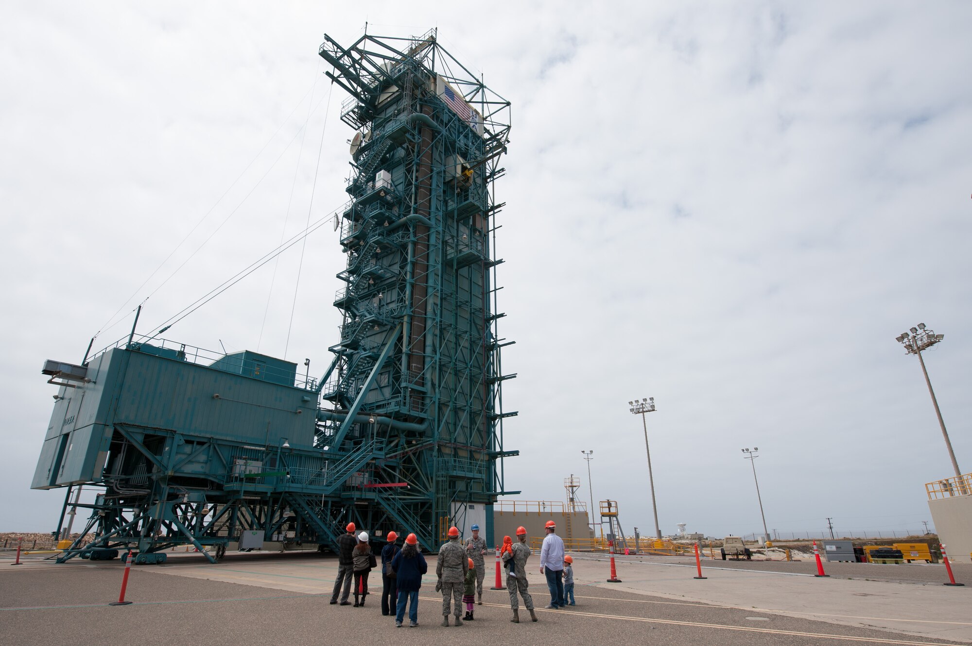 1st Lt. Matthew LeSaint, 4th Space Launch Squadron deputy chief engineer, educates Team V members and their families on the 30th Launch Group mission during the “Space Walk” tour of Space Launch Complex 2, May 8, 2015, Vandenberg Air Force Base, Calif. (U.S. Air Force Photo by Michael Peterson/Released)